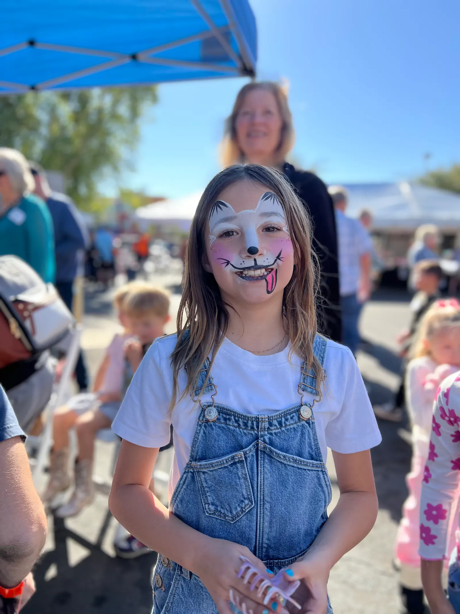 A girl with her face painted at Harvest of Thanks
