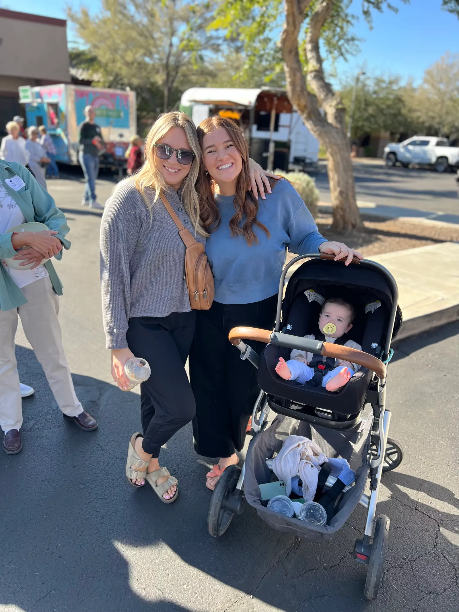 Two women with a stroller at Harvest of Thanks