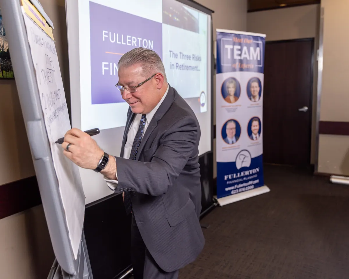 A Fullerton advisor mapping out retirement risks at a client workshop